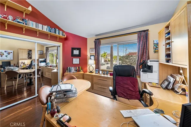 a bedroom with furniture and a window