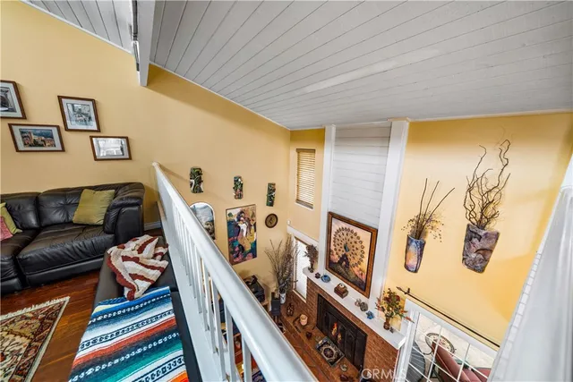 a living room with furniture a rug and a window