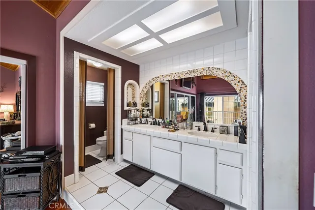 a white house with trees in front of it