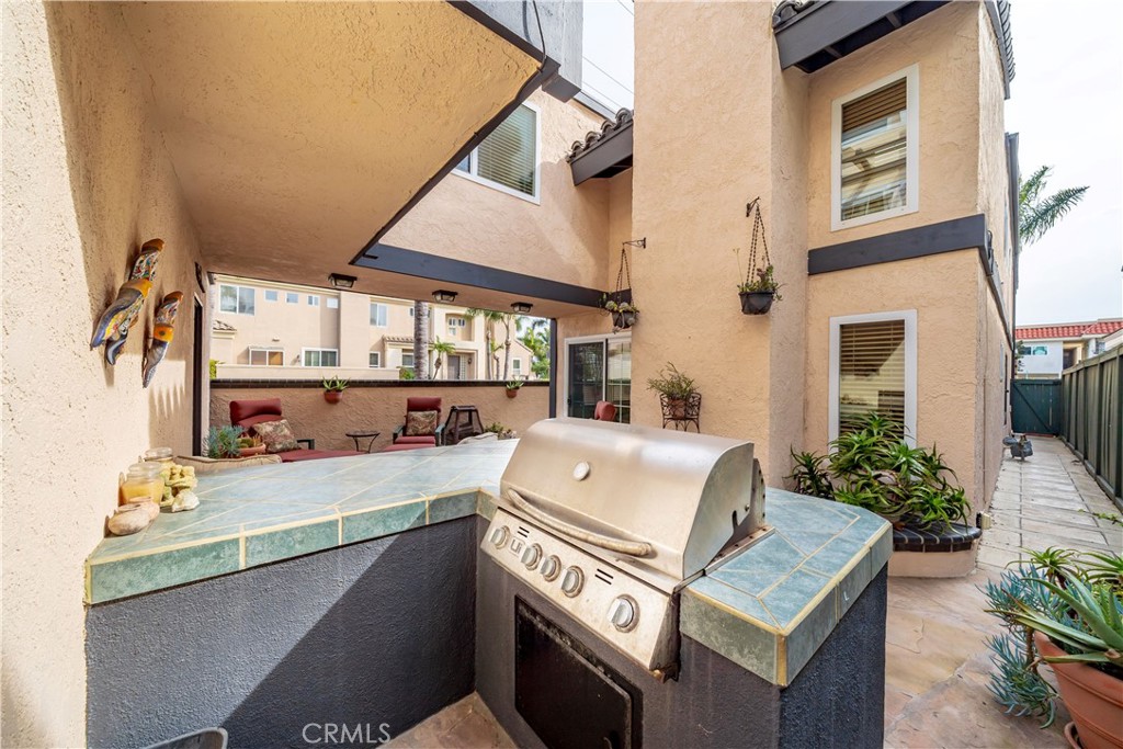 427 21st Street Huntington Beach, CA 92648 - Photo 41 of 63 a front view of a house with outdoor seating