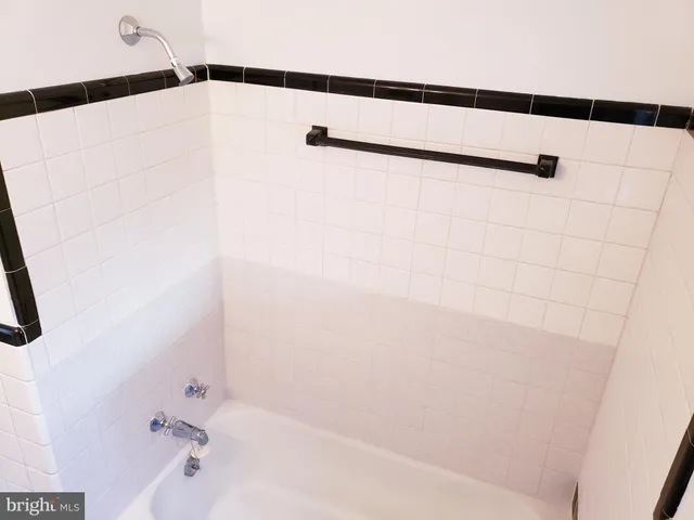 a bathroom with a shower and a shower