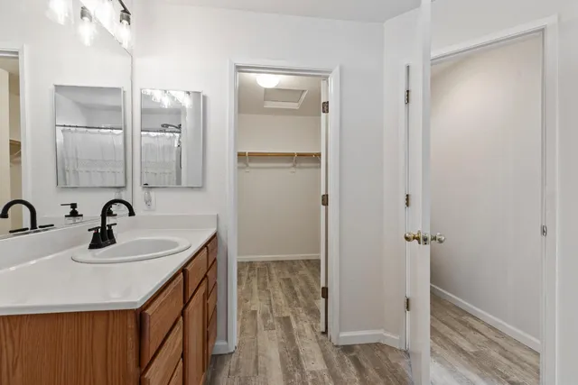 a bathroom with a sink and a mirror