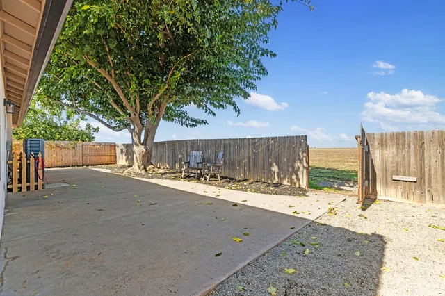 a view of a backyard of the house