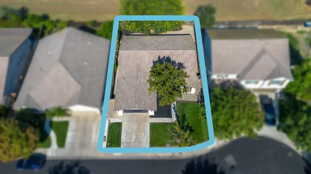 an aerial view of a house with garden