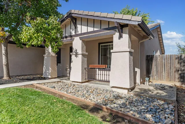 a front view of a house with garden