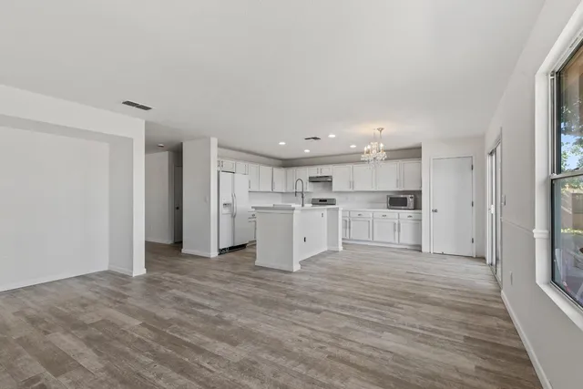 a view of kitchen with wooden floor