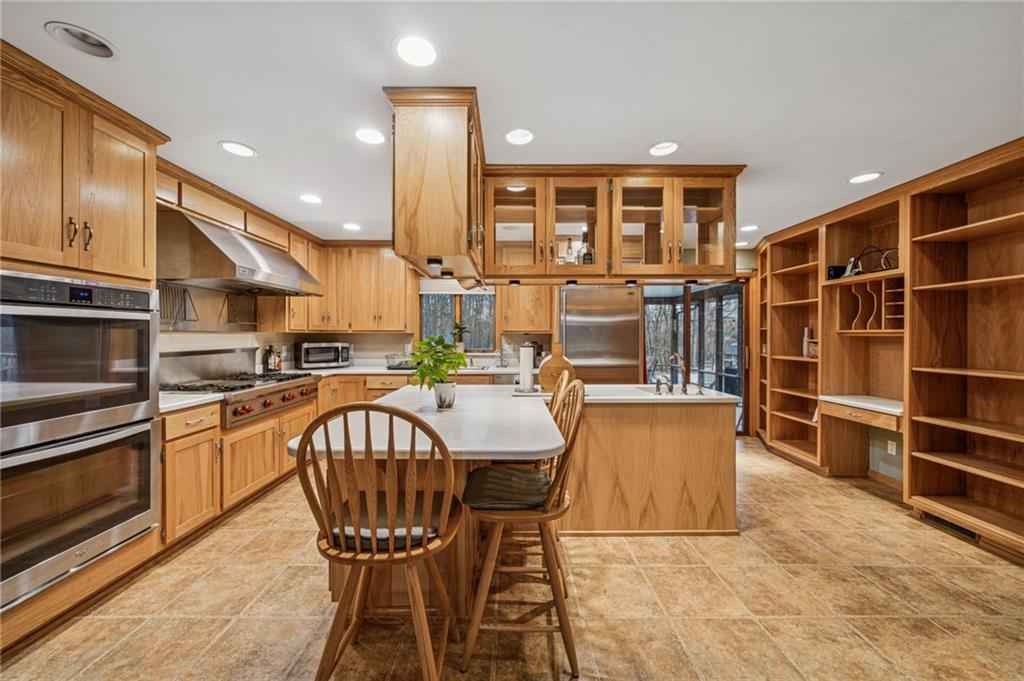 121 Mulberry Street Hopwood, PA 15445 - Photo 18 of 50 a kitchen with stainless steel appliances granite countertop a dining table chairs and granite counter tops