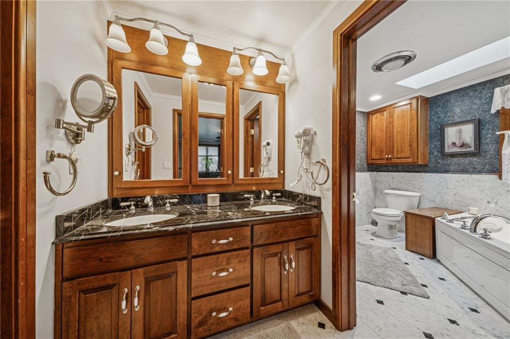 121 Mulberry Street Hopwood, PA 15445 - Photo 25 of 50 a bathroom with a granite countertop double vanity sink and mirror