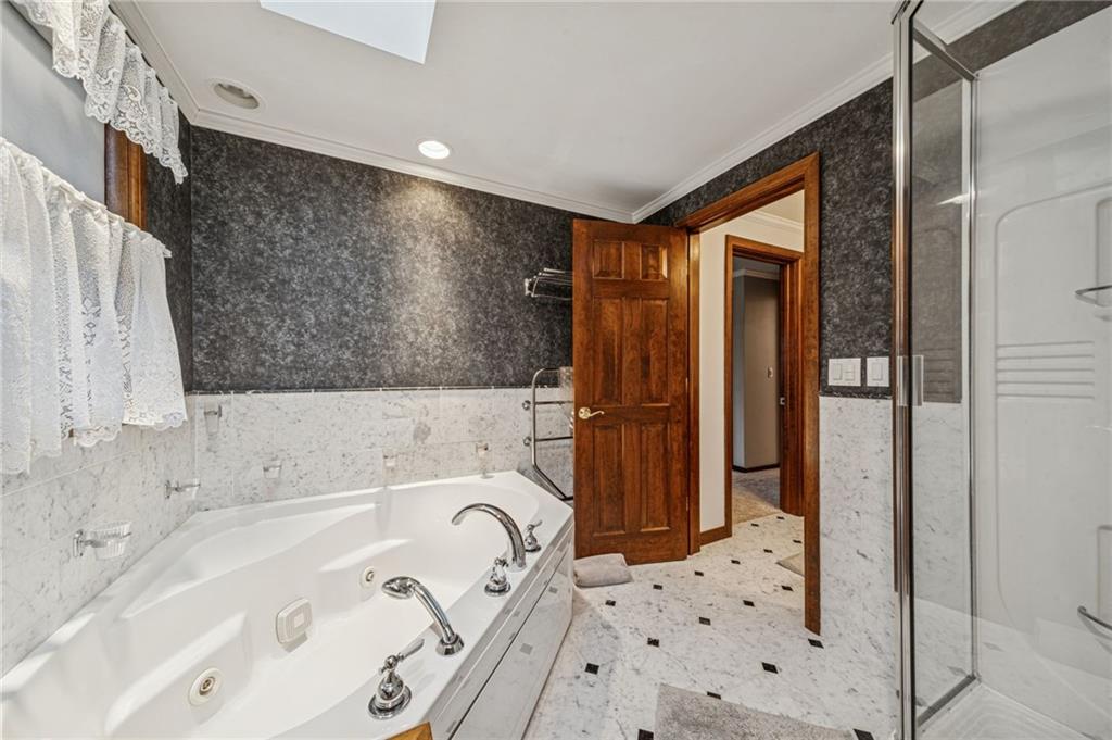 121 Mulberry Street Hopwood, PA 15445 - Photo 27 of 50 a bathroom with a bathtub and a shower