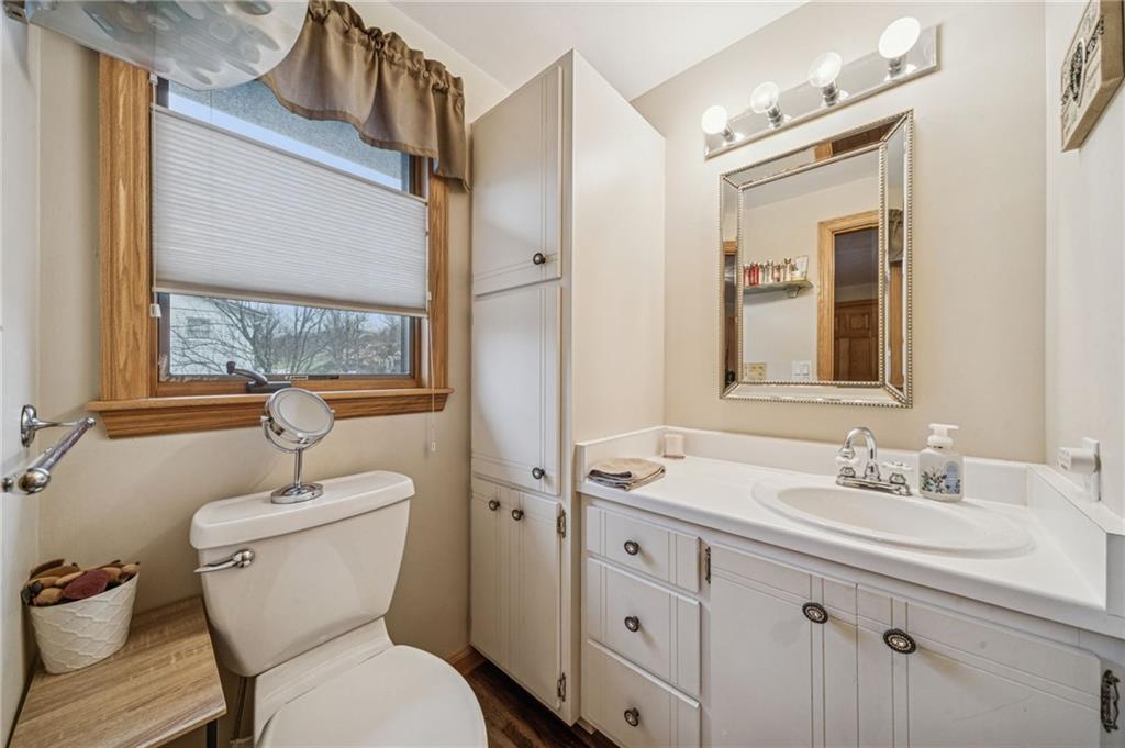 121 Mulberry Street Hopwood, PA 15445 - Photo 30 of 50 a bathroom with a toilet sink and mirror