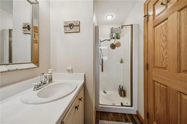 a bedroom with a bed window and dresser