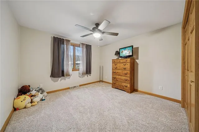 a bathroom with a sink mirror and toilet