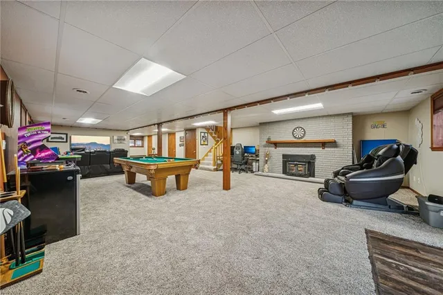 a bedroom with furniture and a wooden floor
