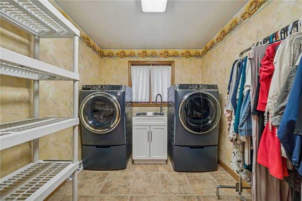 121 Mulberry Street Hopwood, PA 15445 - Photo 44 of 50 a view of walk in closet with clothes and shoes