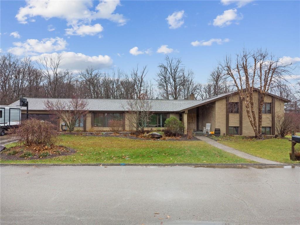 121 Mulberry Street Hopwood, PA 15445 - Photo 45 of 50 a view of a house with a yard and garage