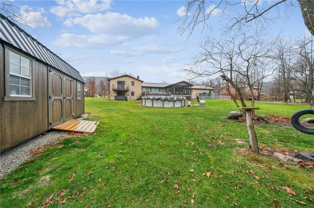 121 Mulberry Street Hopwood, PA 15445 - Photo 49 of 50 a view of a house with a yard and a tub