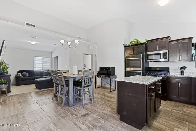 a view of a dining room kitchen and furniture