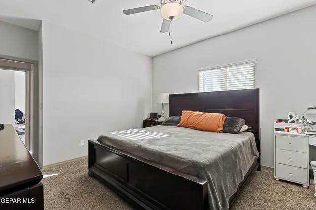 a bedroom with a bed and dresser