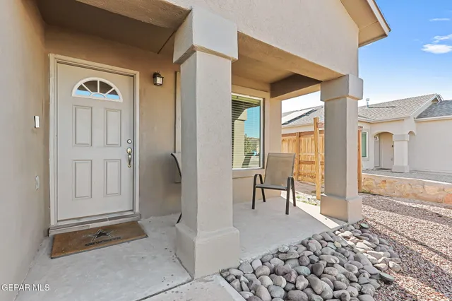 a view of a entryway door and hallway