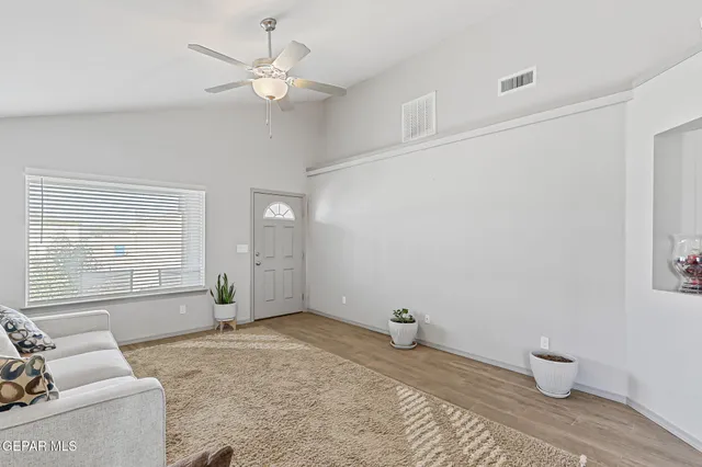 a living room with furniture and a large window