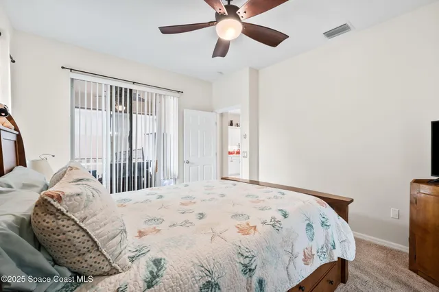 a bathroom with a bathtub a double vanity sink a toilet a shower and a mirror