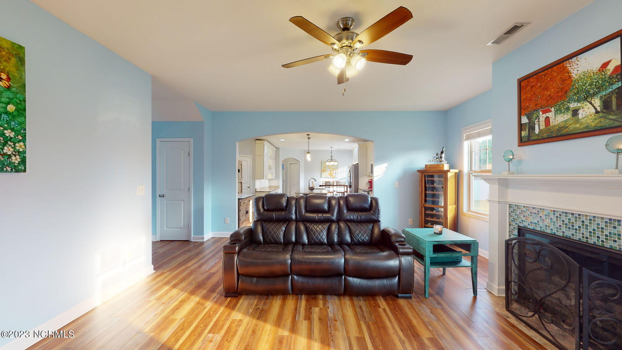 301 Echo Ridge Road Swansboro, NC 28584 - Photo 8 of 48 living room with arched entryway to kitchen