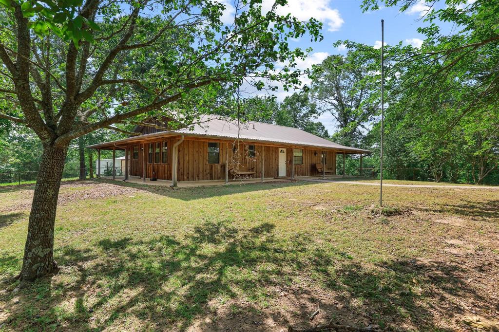2042 East 1980 Road Antlers, OK 74523 - Photo 1 of 33 a house with trees in the background