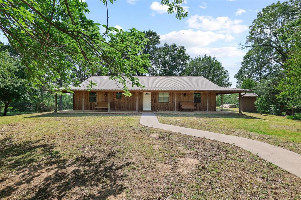 2042 East 1980 Road Antlers, OK 74523 - Photo 13 of 33 a front view of a house with a yard