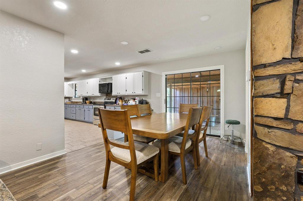2042 East 1980 Road Antlers, OK 74523 - Photo 17 of 33 a view of a dining room with furniture and wooden floor