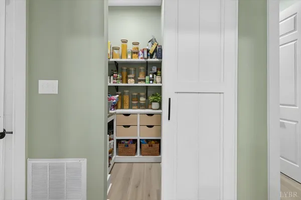a shelf with books and knick knacks on it
