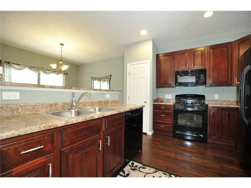 202 Maple Ridge Drive Canonsburg, PA 15317 - Photo 6 of 17 Kitchen. Cherry cabinets and fully equipped with appliances. Raised bar on island and there is a pantry.