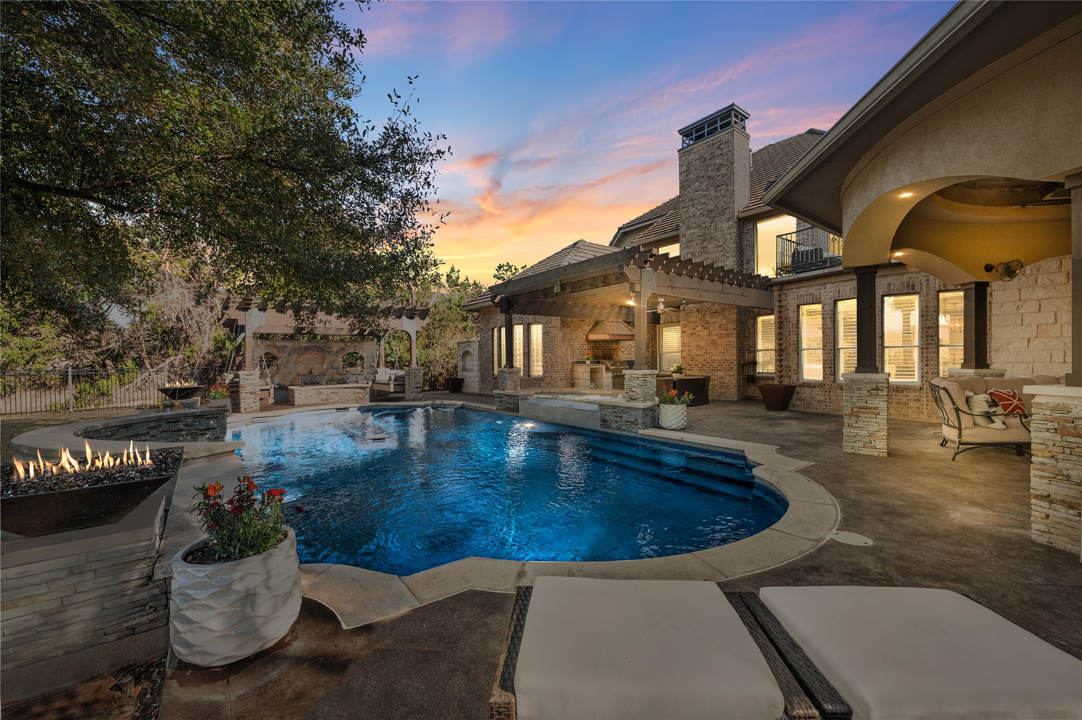 Welcome to 11700 Eagles Glen Drive, an effortlessly modern and inviting estate located within the gates of the UT Golf Club community.