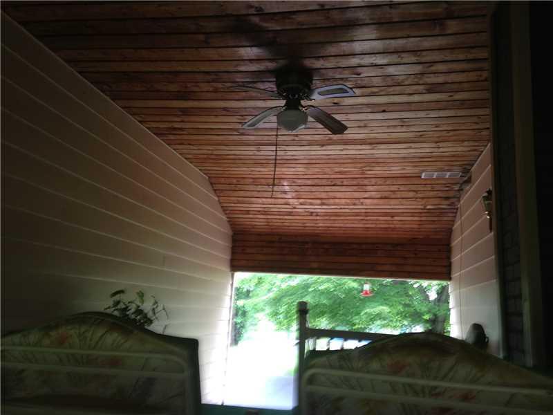 29 Elliot Road West Middlesex, PA 16159 - Photo 6 of 14 Patio/Deck. Breezeway between house and garage. Ceiling lined with knotty pine.