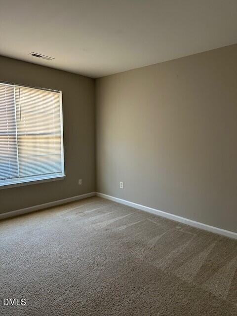 15 Red Lane Raleigh, NC 27606 - Photo 3 of 16 an empty room with a window