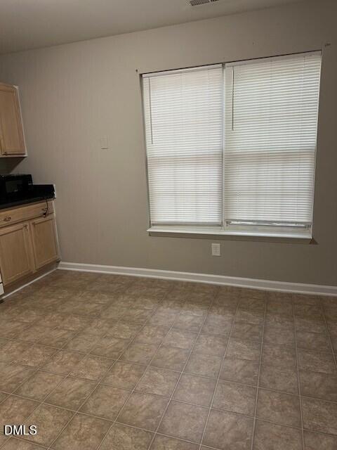 15 Red Lane Raleigh, NC 27606 - Photo 5 of 16 a view of an empty room with a window