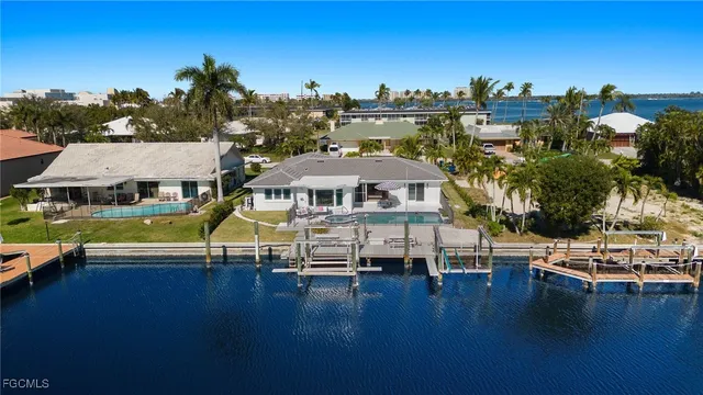a aerial view of a house with swimming pool and deck