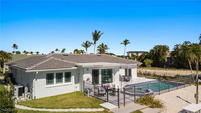 a view of a swimming pool with sitting area