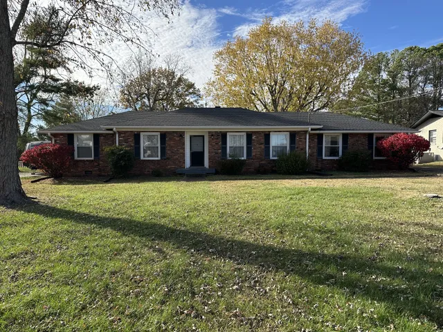 front view of a house with a garden
