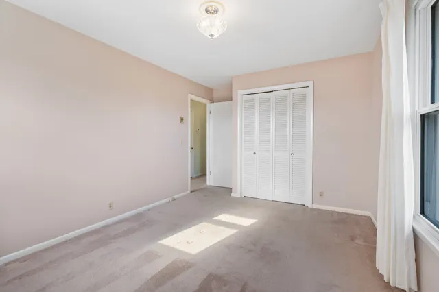 a view of a house with a yard and garage
