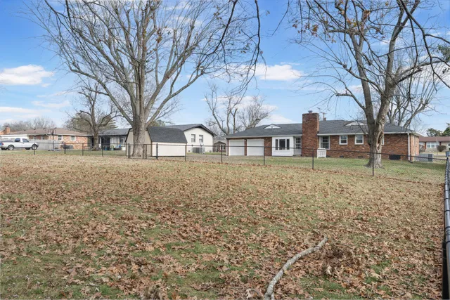 a view of outdoor space with deck and yard