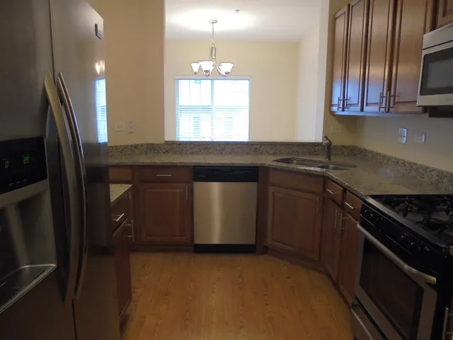 a kitchen with a refrigerator and cabinets