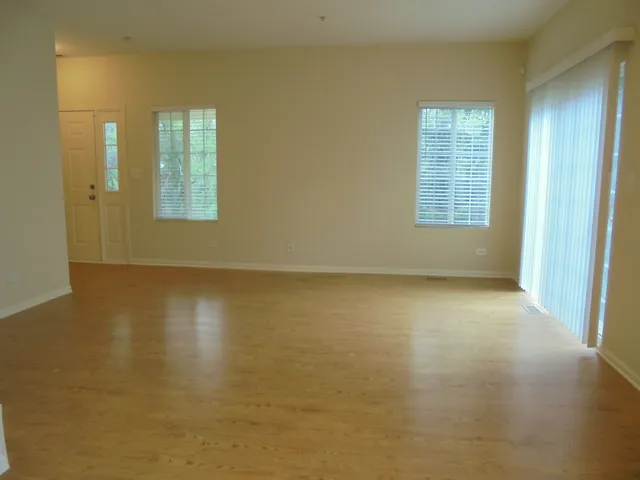 a kitchen with granite countertop a stove top oven microwave and cabinets
