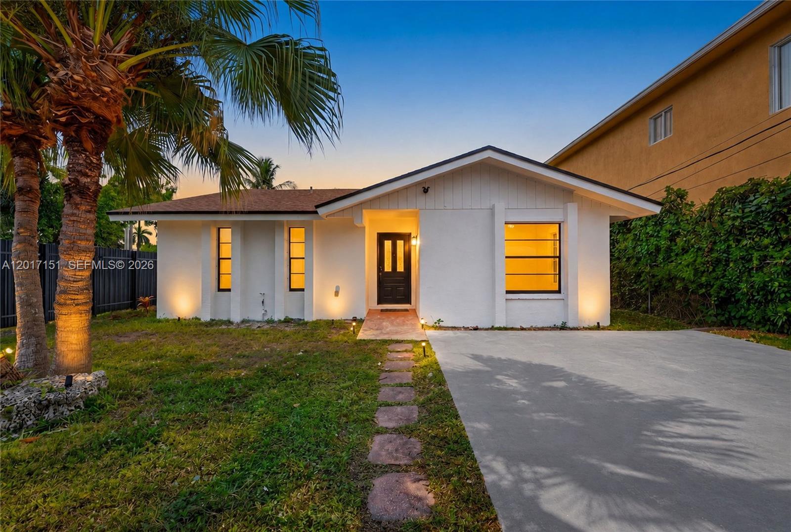 10210 Southwest 175th Street Miami, FL 33157 - Photo 1 of 25 a front view of a house with a yard