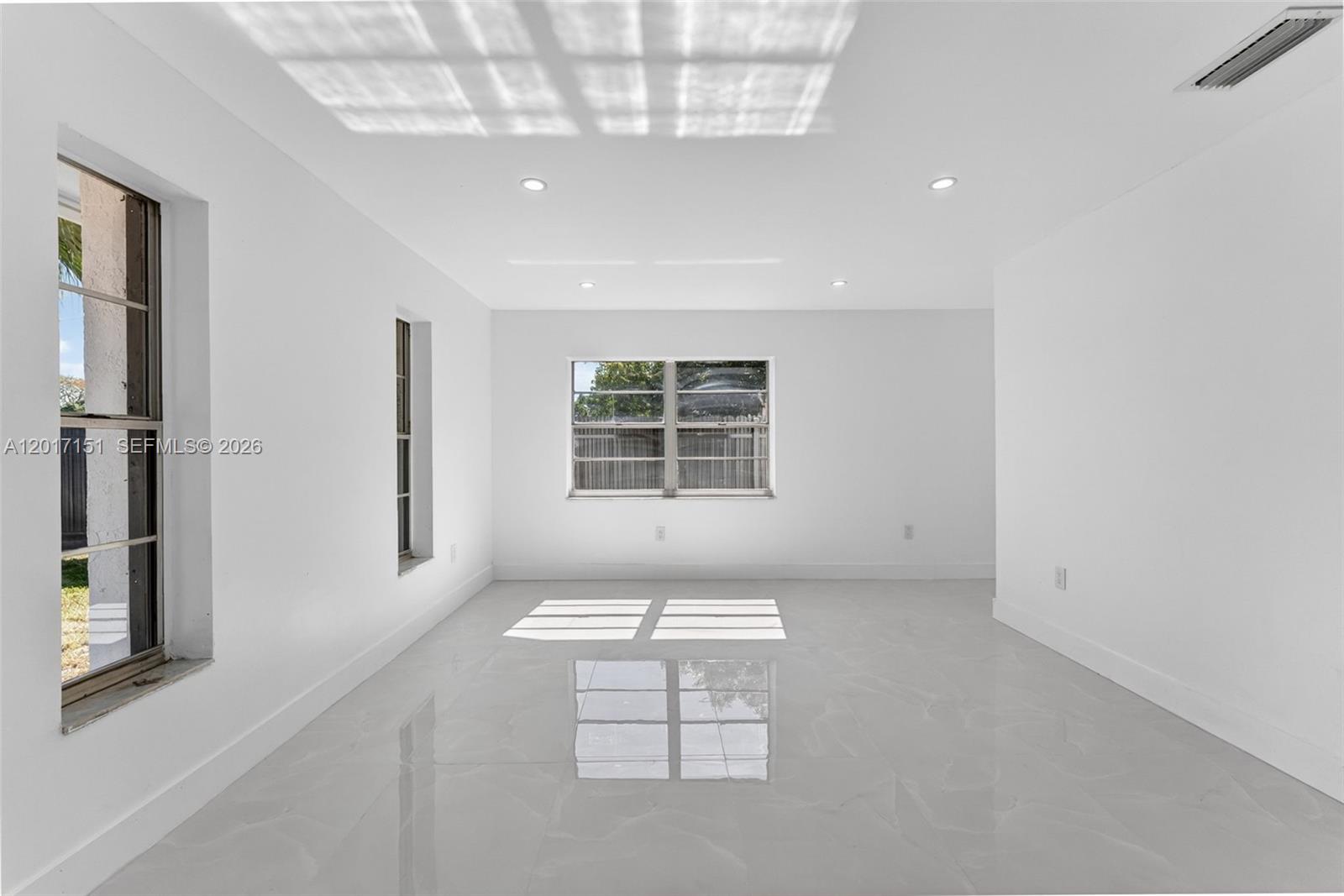 10210 Southwest 175th Street Miami, FL 33157 - Photo 11 of 25 an empty room with windows