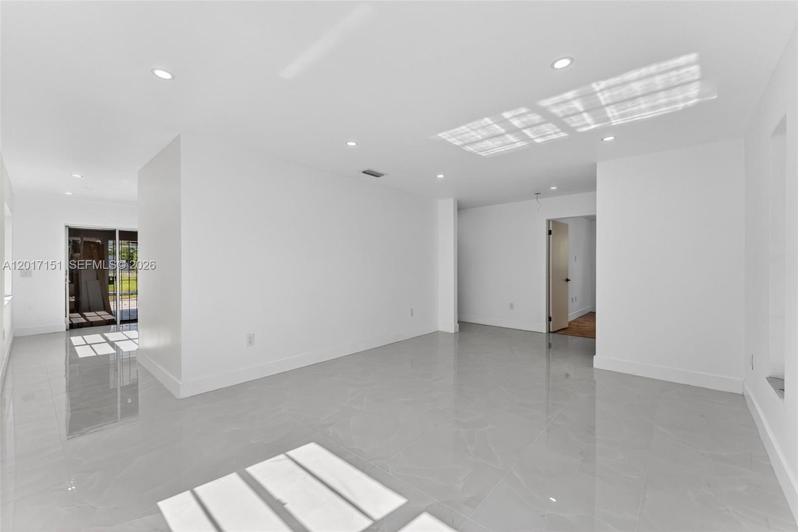 10210 Southwest 175th Street Miami, FL 33157 - Photo 13 of 25 wooden floor in an empty room with a window