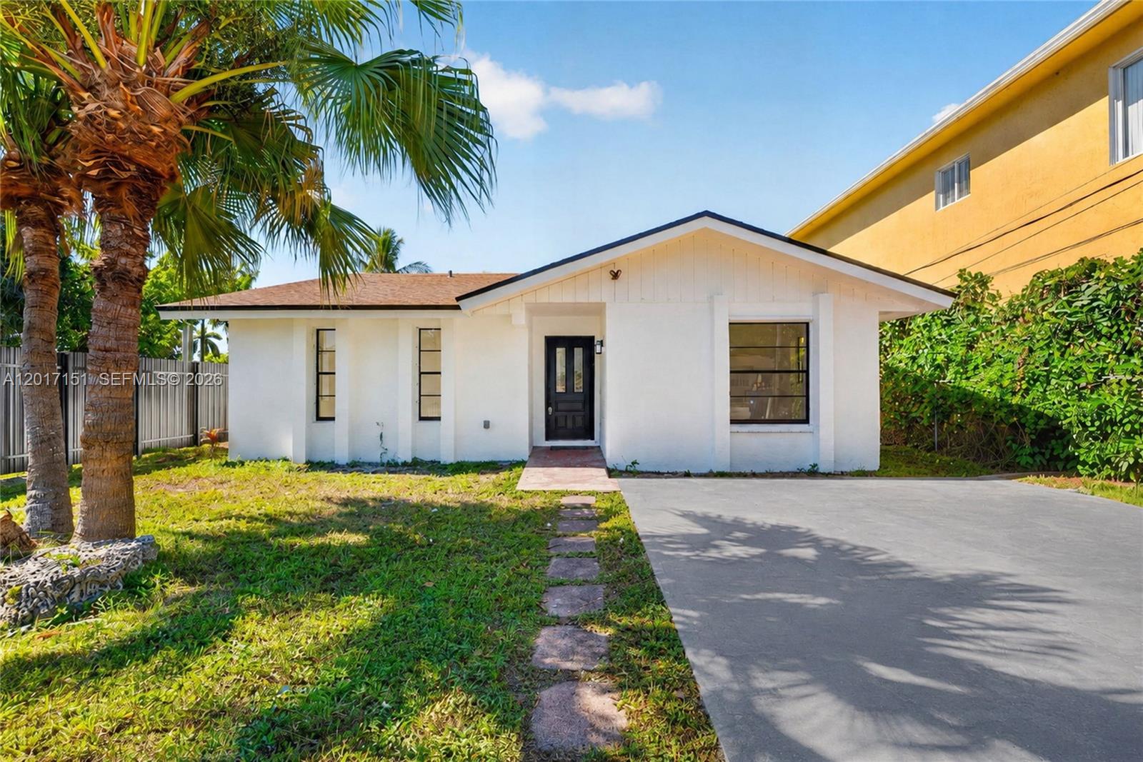 10210 Southwest 175th Street Miami, FL 33157 - Photo 2 of 25 a front view of house with yard and green space