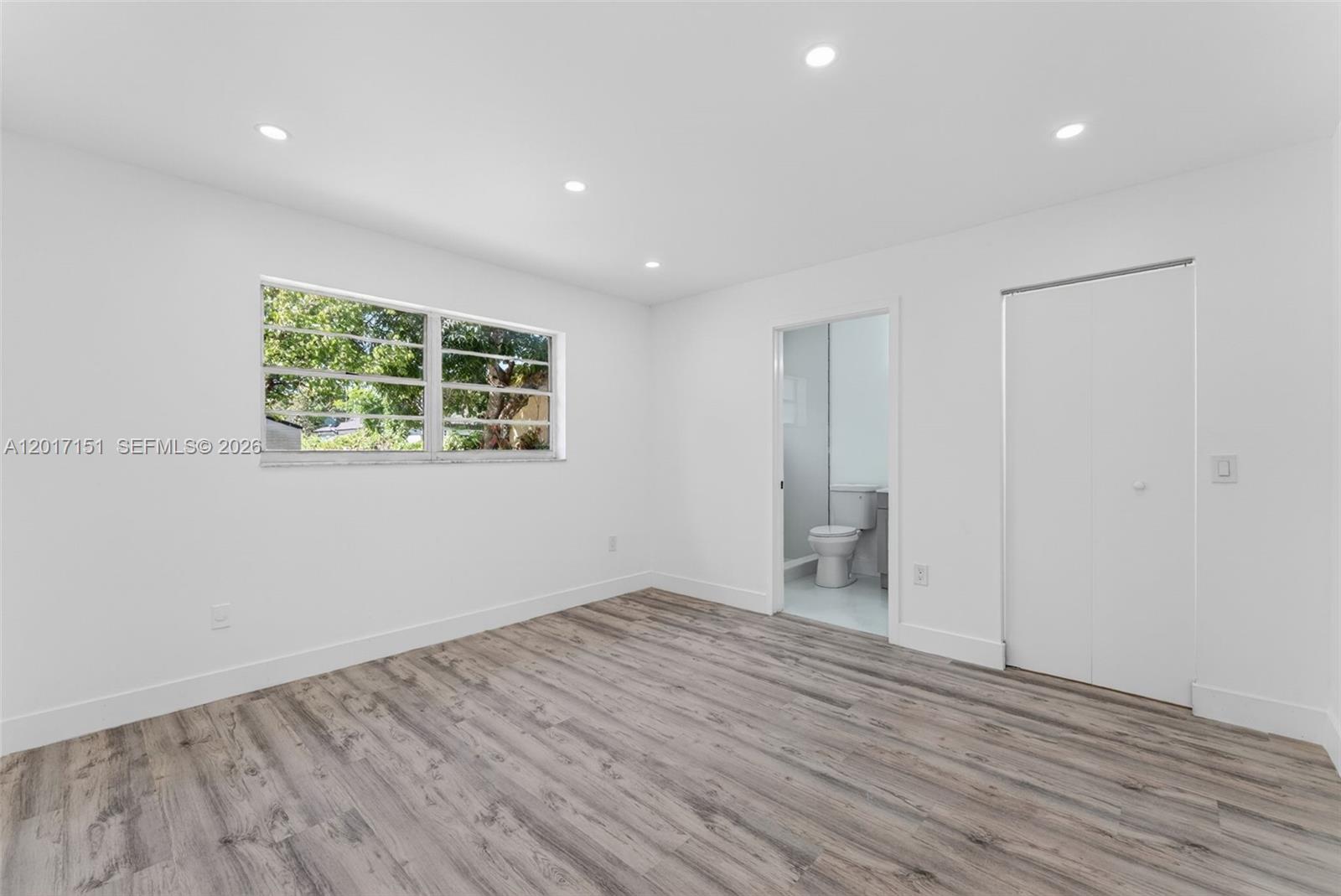 10210 Southwest 175th Street Miami, FL 33157 - Photo 23 of 25 wooden floor in an empty room with a window