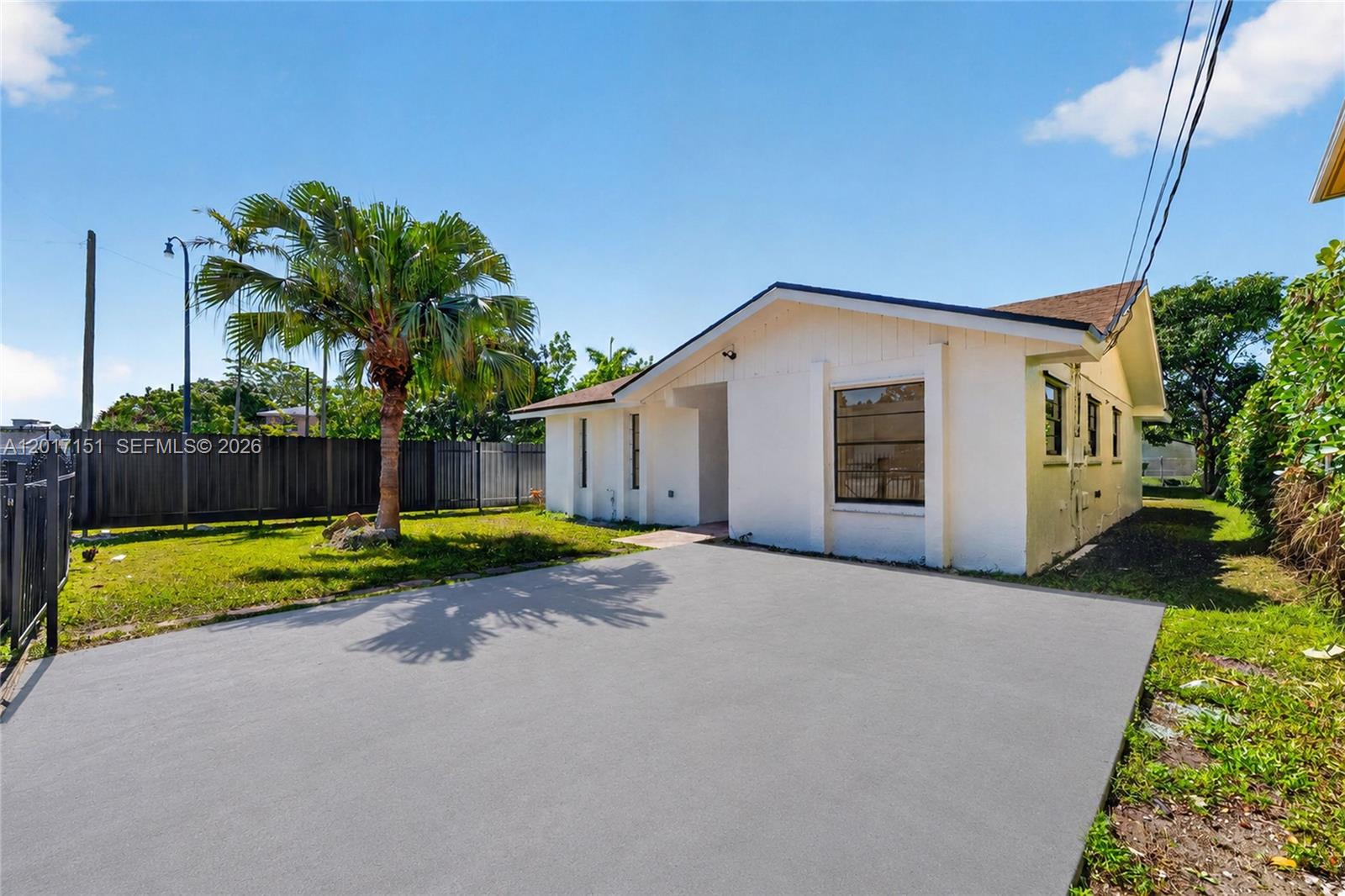 10210 Southwest 175th Street Miami, FL 33157 - Photo 3 of 25 a view of a house with backyard and a garden