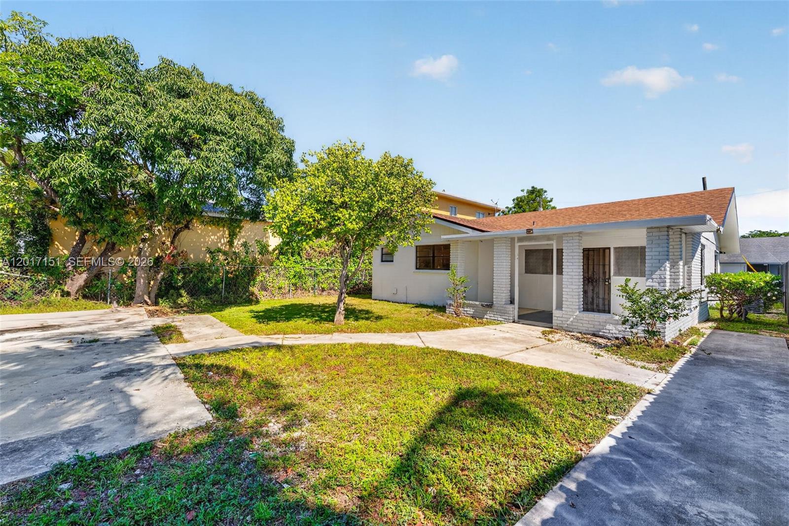 10210 Southwest 175th Street Miami, FL 33157 - Photo 4 of 25 a house with swimming pool in front of it