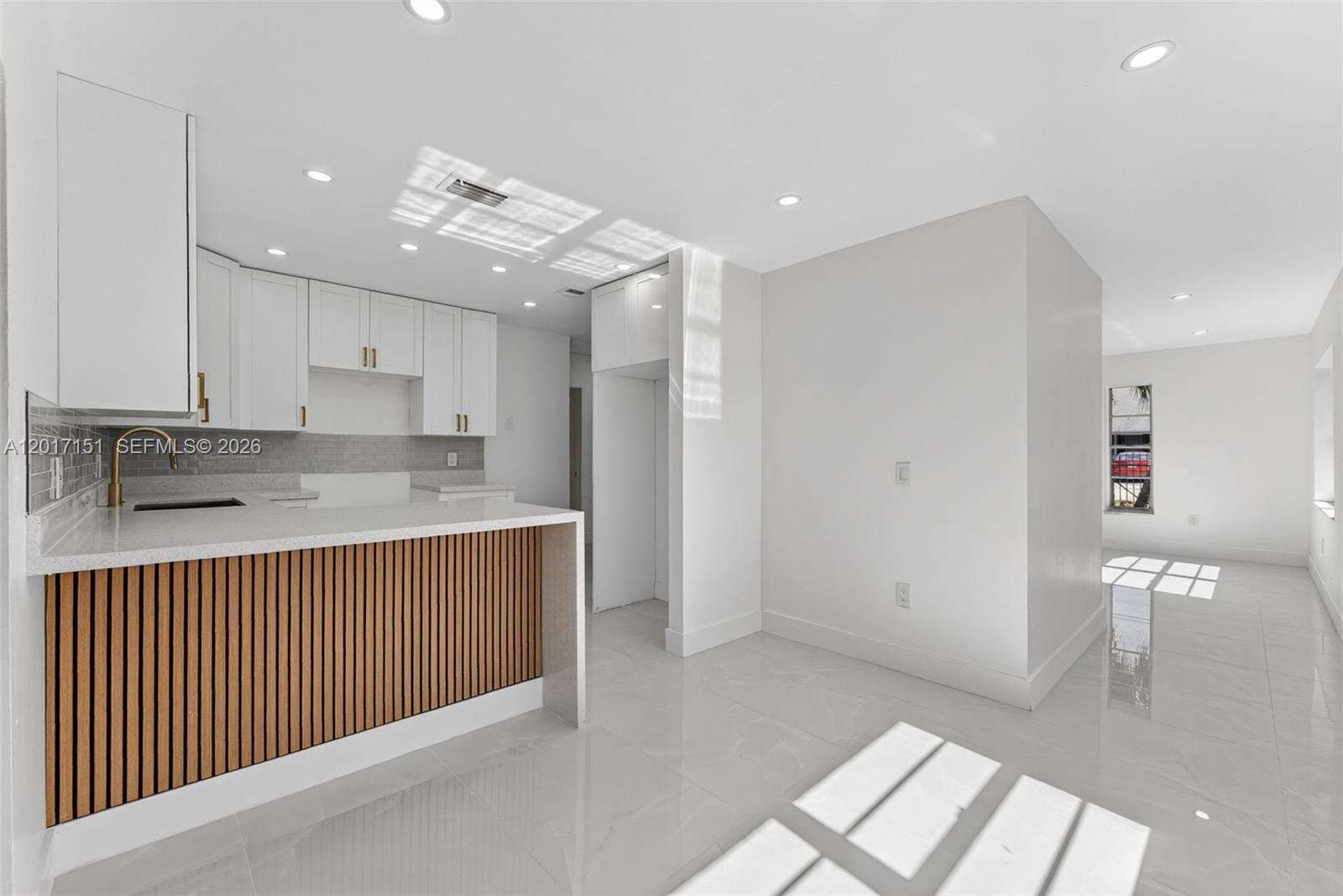 10210 Southwest 175th Street Miami, FL 33157 - Photo 5 of 25 a kitchen with stainless steel appliances granite countertop a sink and cabinets